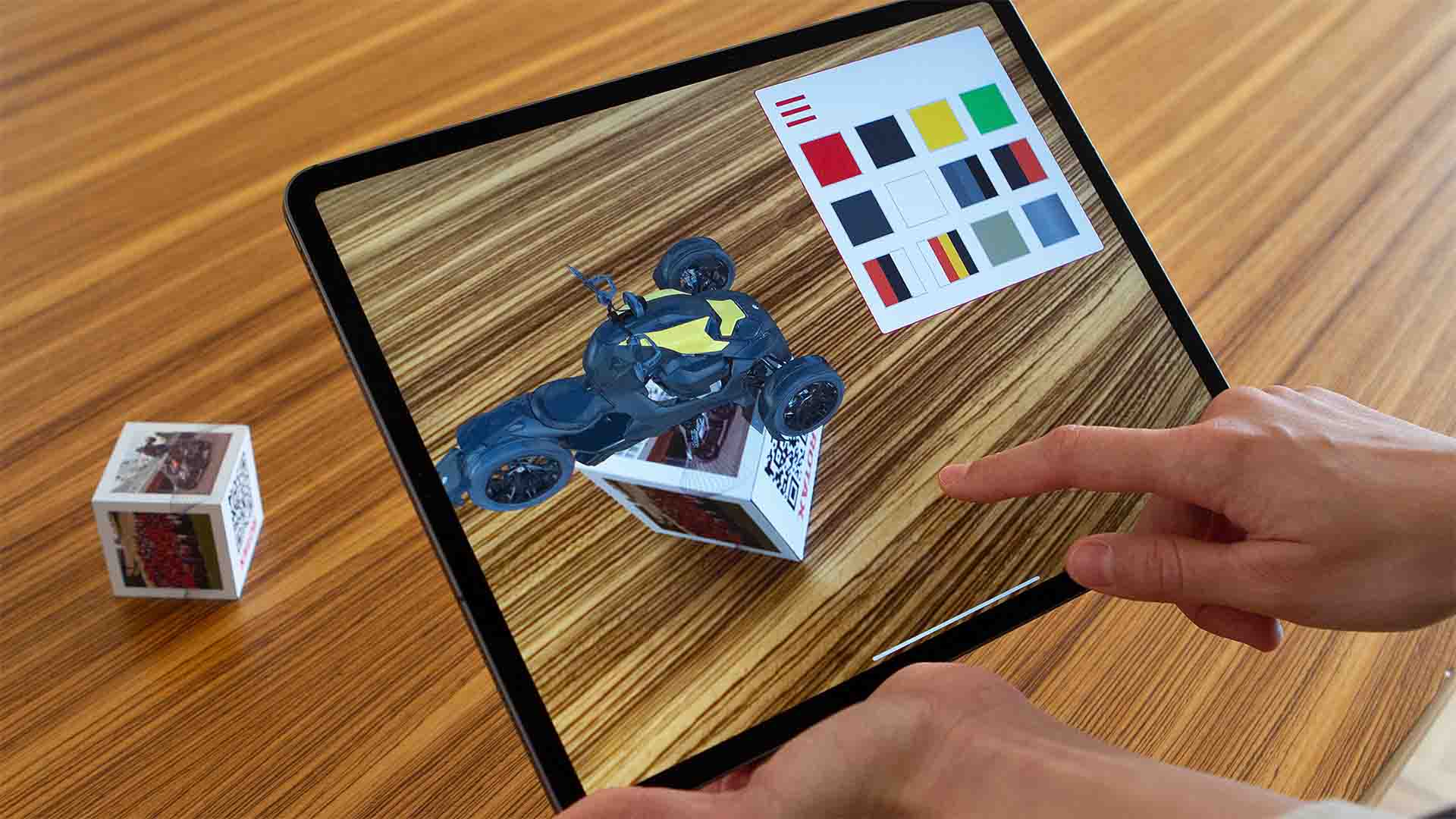 The „Rotax 100+“ Augmented Reality app brings a 6-sided real cube to life by showing digital, interactive content for each side.